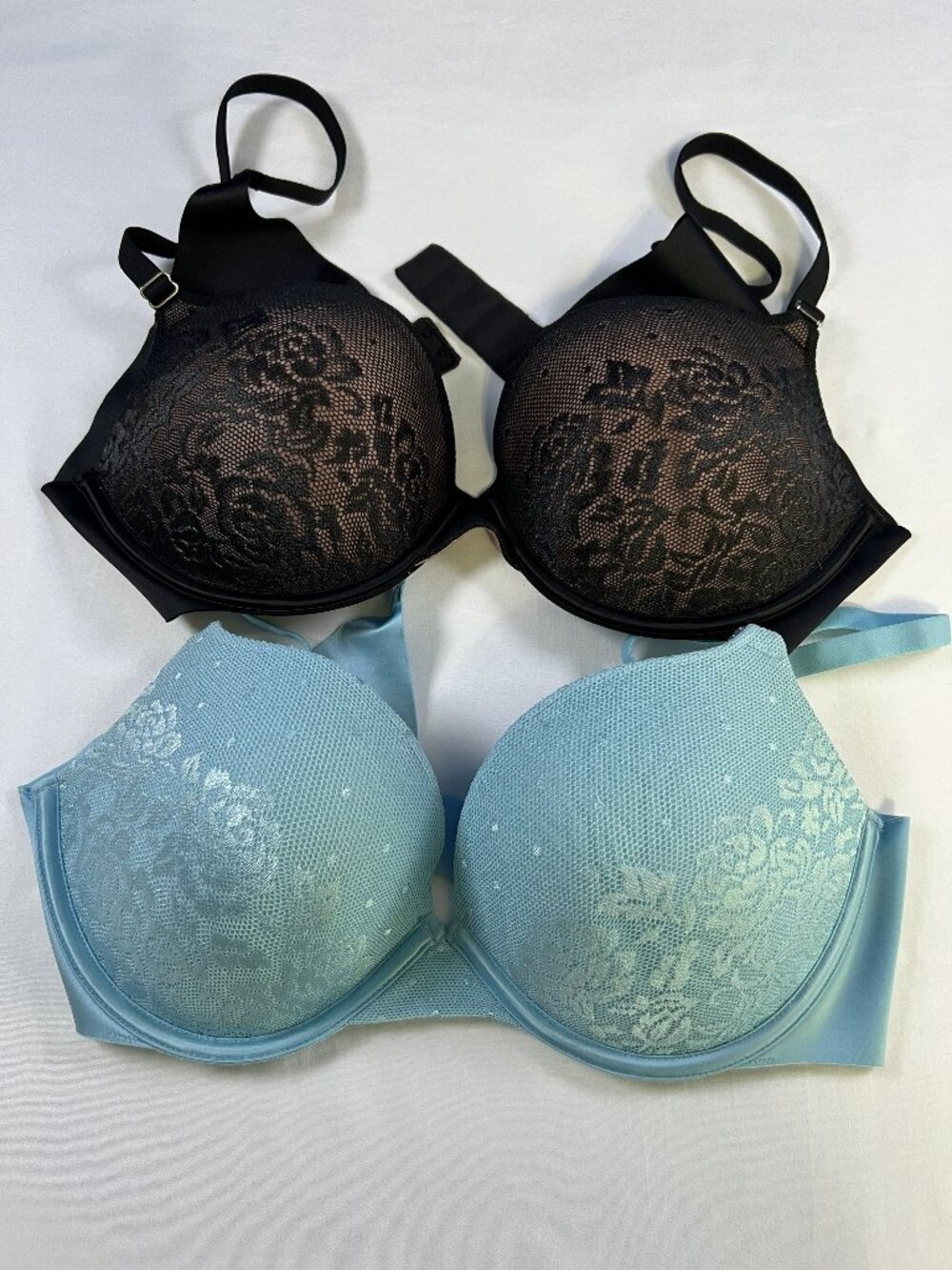 2 pair of secret treasures 38B laced bras in black and light blue